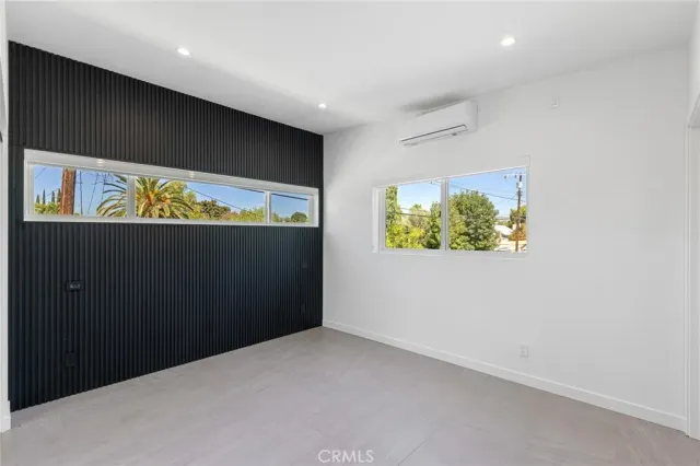 en suite bathroom with a sink and large window