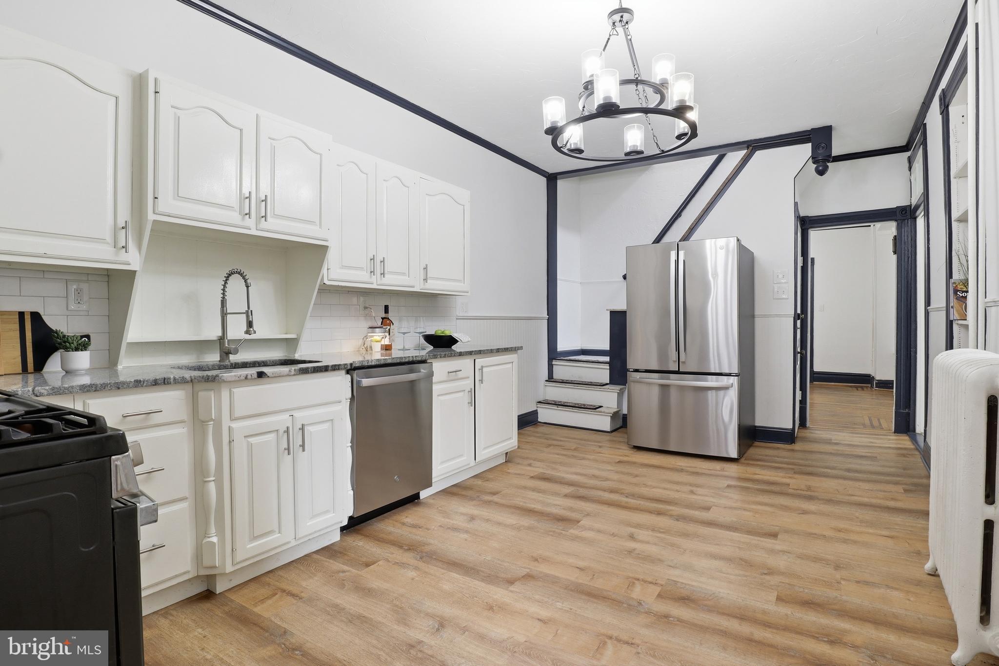 812 South George Street York, PA 17403 - Photo 13 of 58 a kitchen with stainless steel appliances a refrigerator sink and cabinets
