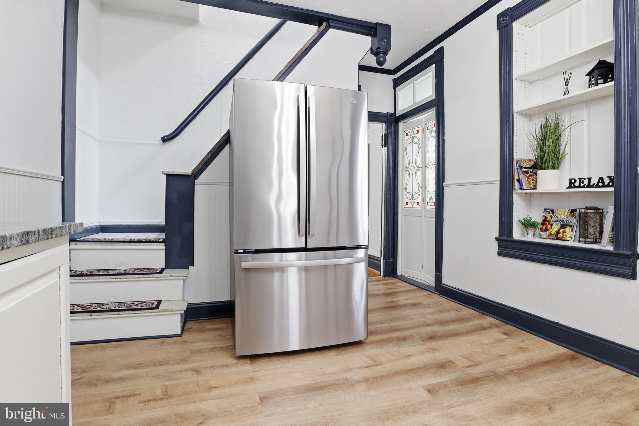 812 South George Street York, PA 17403 - Photo 15 of 58 a view of a hallway with wooden floor and staircase