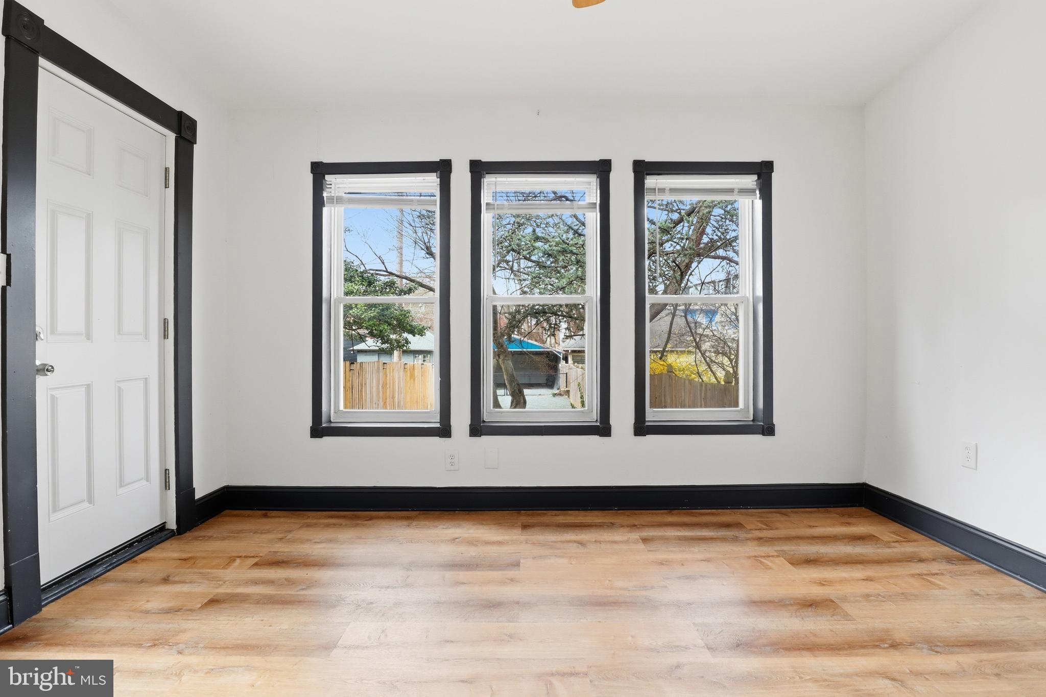 812 South George Street York, PA 17403 - Photo 16 of 58 a view of an empty room with wooden floor and a window