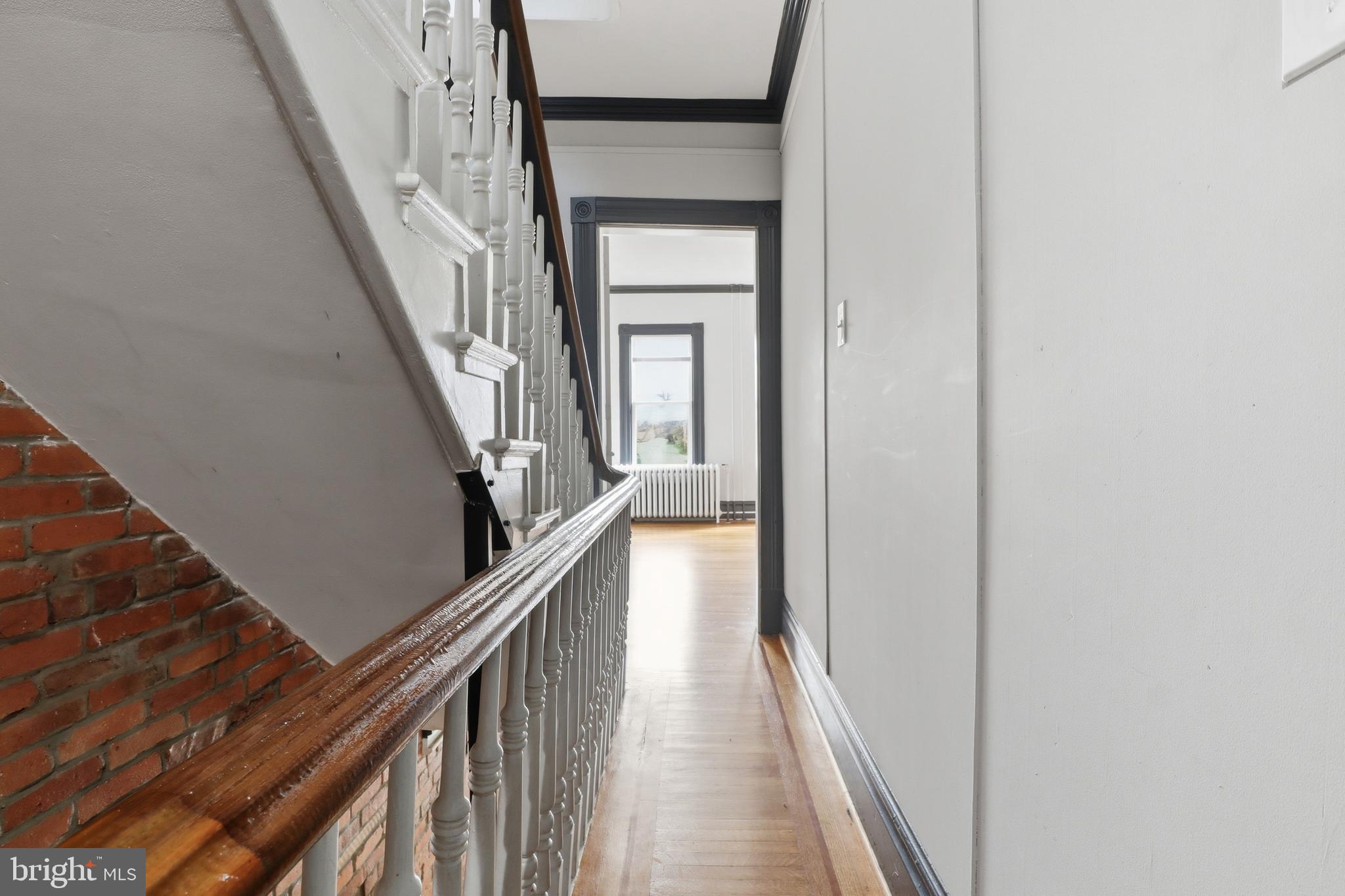 812 South George Street York, PA 17403 - Photo 22 of 58 a view of a hallway with wooden floor and stairs