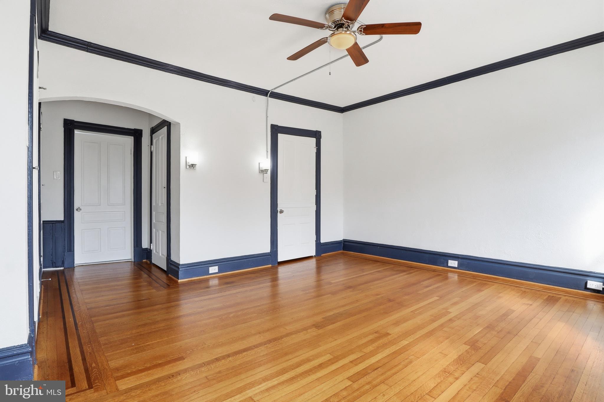 812 South George Street York, PA 17403 - Photo 25 of 58 a view of an empty room with wooden floor and a window