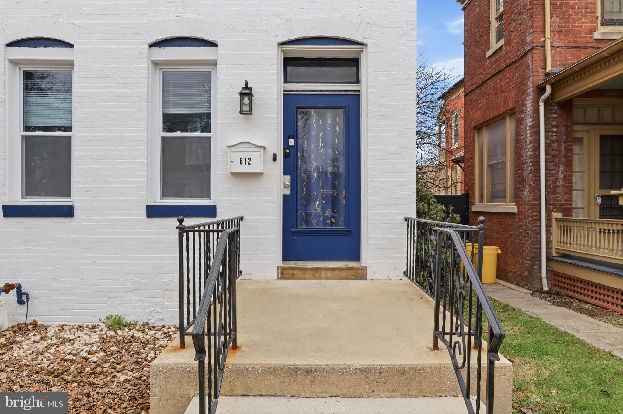 812 South George Street York, PA 17403 - Photo 3 of 58 a front view of a house with wooden fence