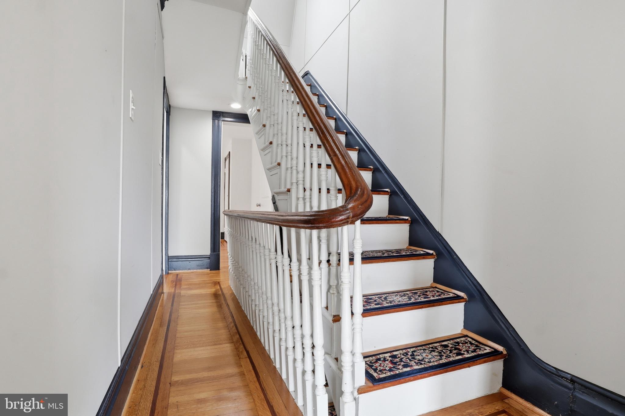 812 South George Street York, PA 17403 - Photo 39 of 58 a view of staircase with wooden floor and white walls