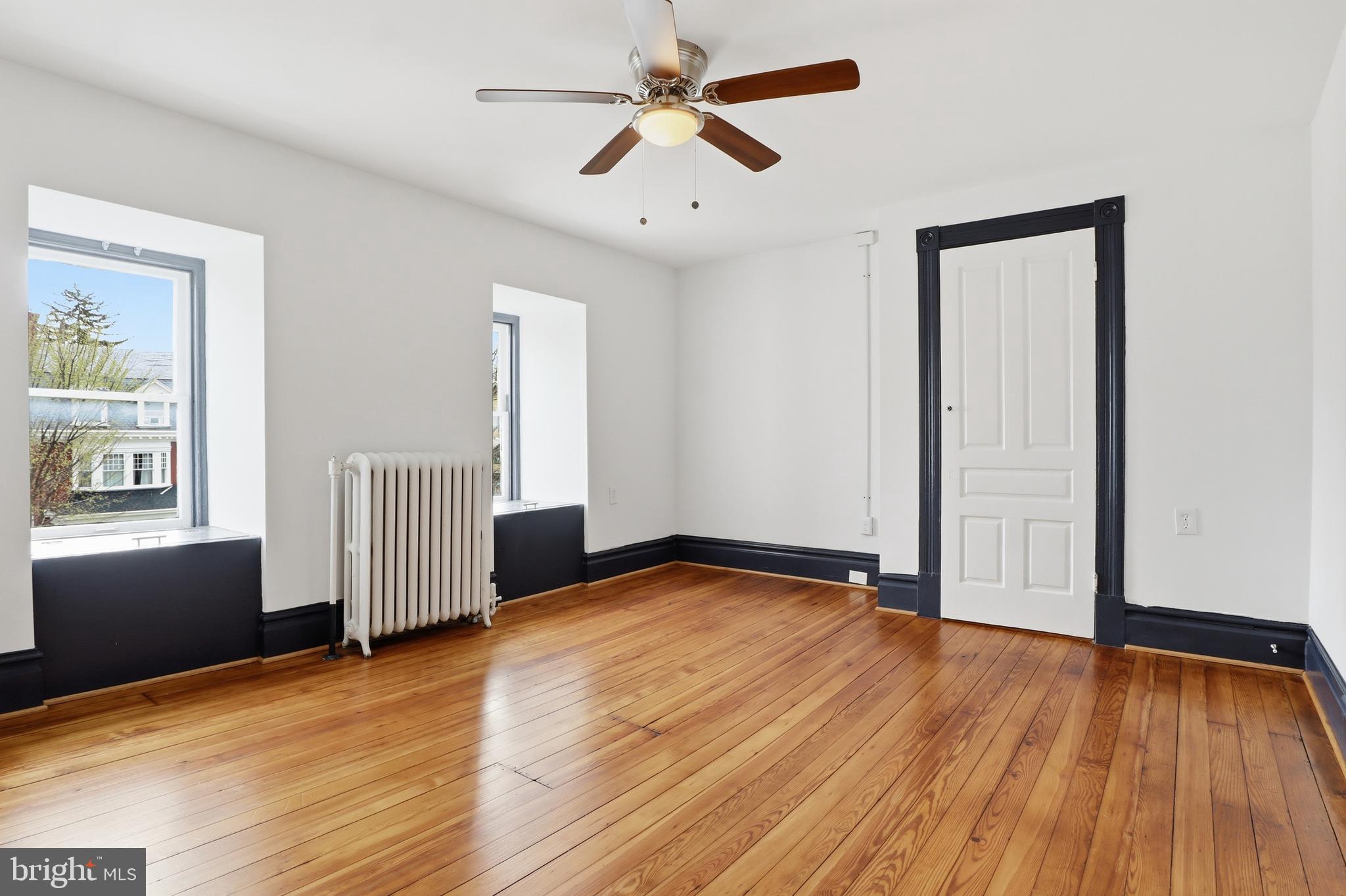 812 South George Street York, PA 17403 - Photo 44 of 58 wooden floor in an empty room with a window