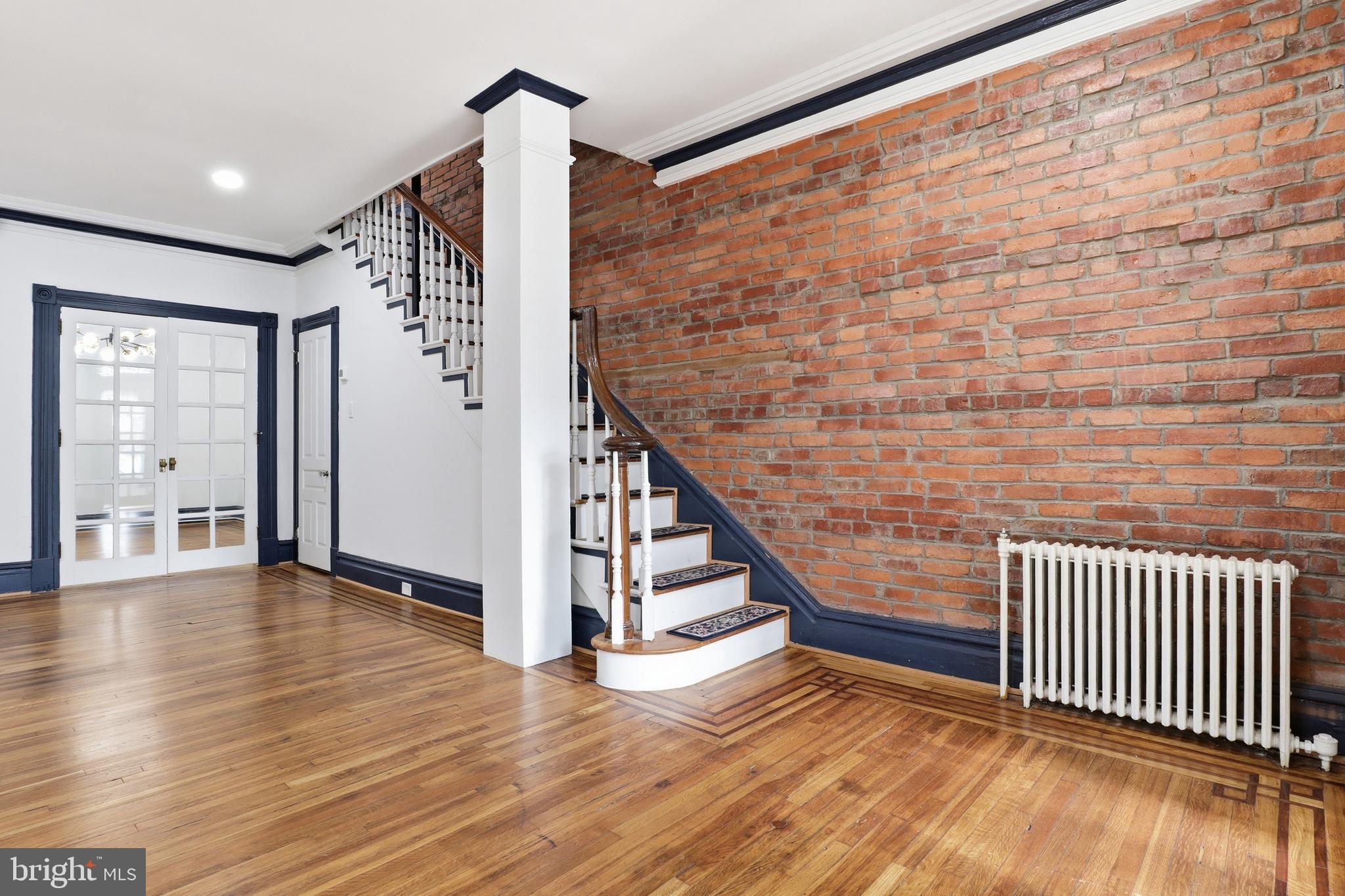 812 South George Street York, PA 17403 - Photo 5 of 58 a view of a hallway with wooden floor and stairs