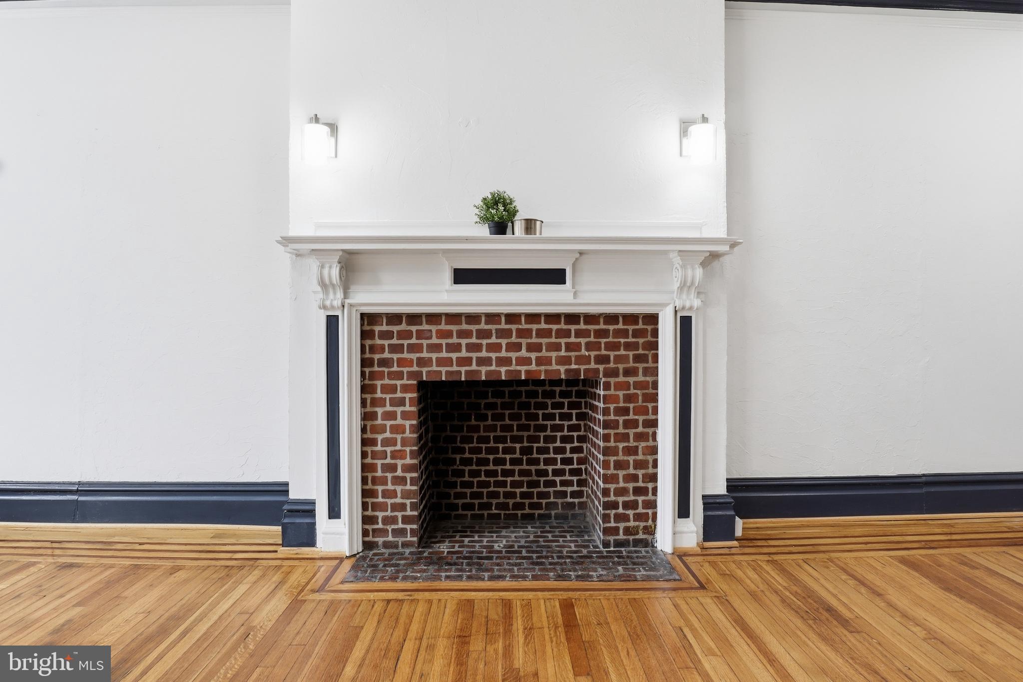 812 South George Street York, PA 17403 - Photo 6 of 58 a view of fireplace with wooden floor
