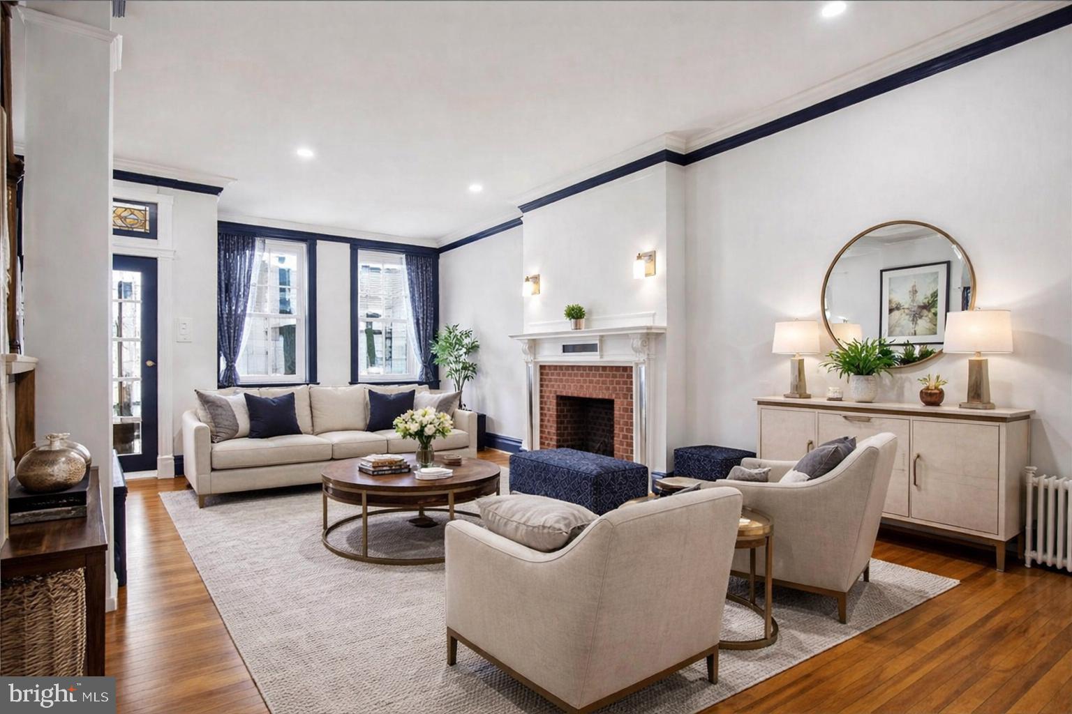 812 South George Street York, PA 17403 - Photo 8 of 58 a living room with furniture a fireplace and a potted plant