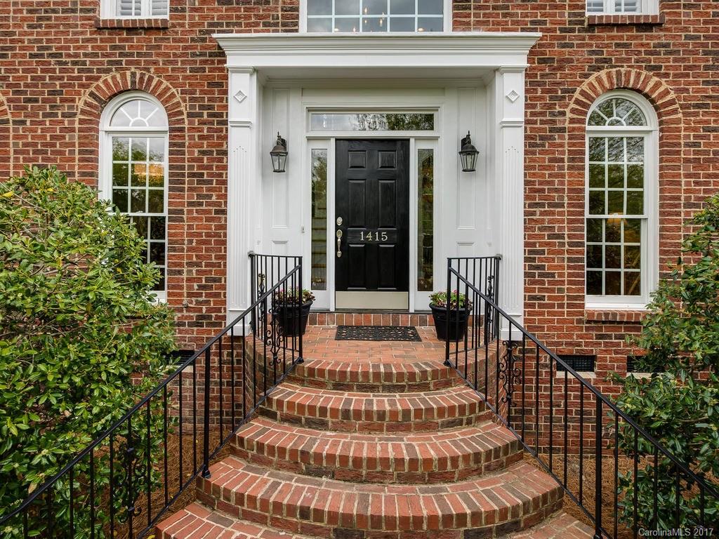 1415 Windy Ridge Road Charlotte, NC 28270 - Photo 2 of 24 a front view of a house with a garden