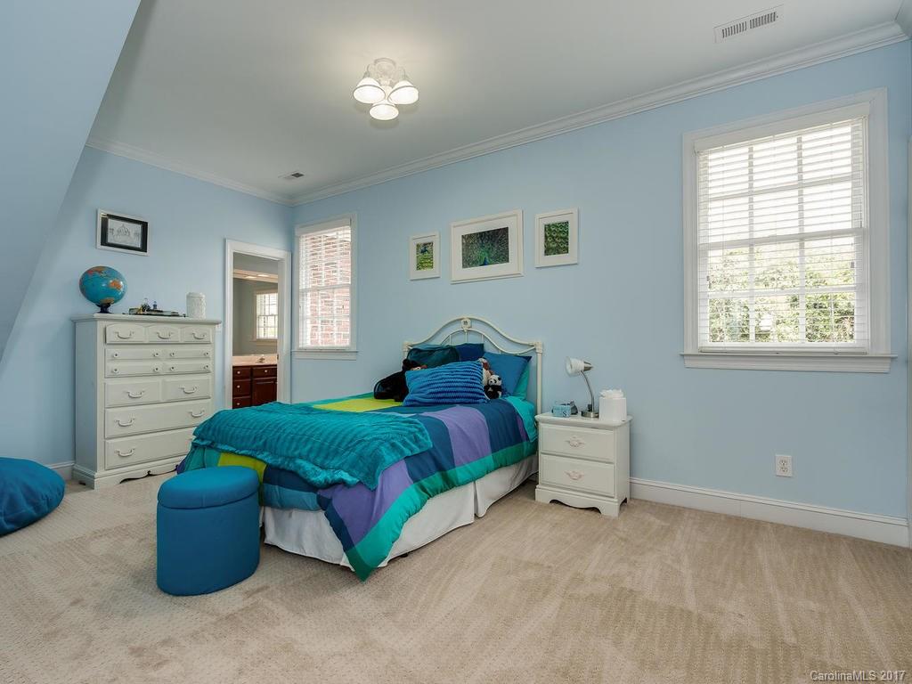 1415 Windy Ridge Road Charlotte, NC 28270 - Photo 16 of 24 a spacious bedroom with a bed and window