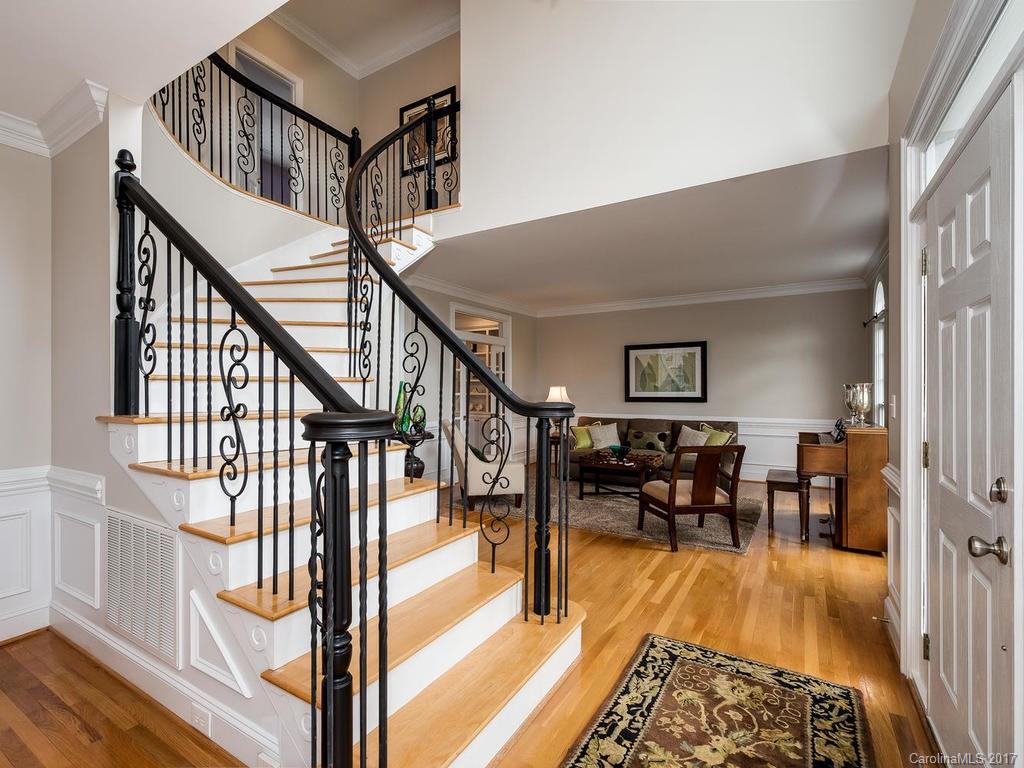 1415 Windy Ridge Road Charlotte, NC 28270 - Photo 3 of 24 a view of a livingroom with furniture wooden floor and stairs