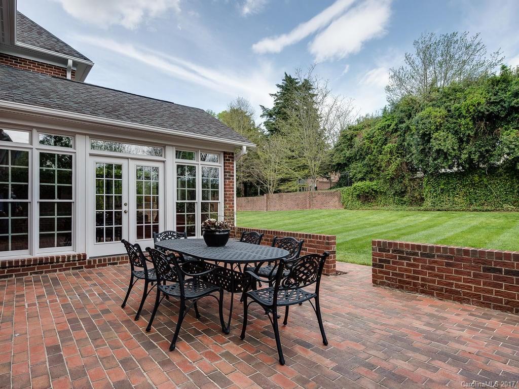 1415 Windy Ridge Road Charlotte, NC 28270 - Photo 22 of 24 a view of a patio with a table and chairs