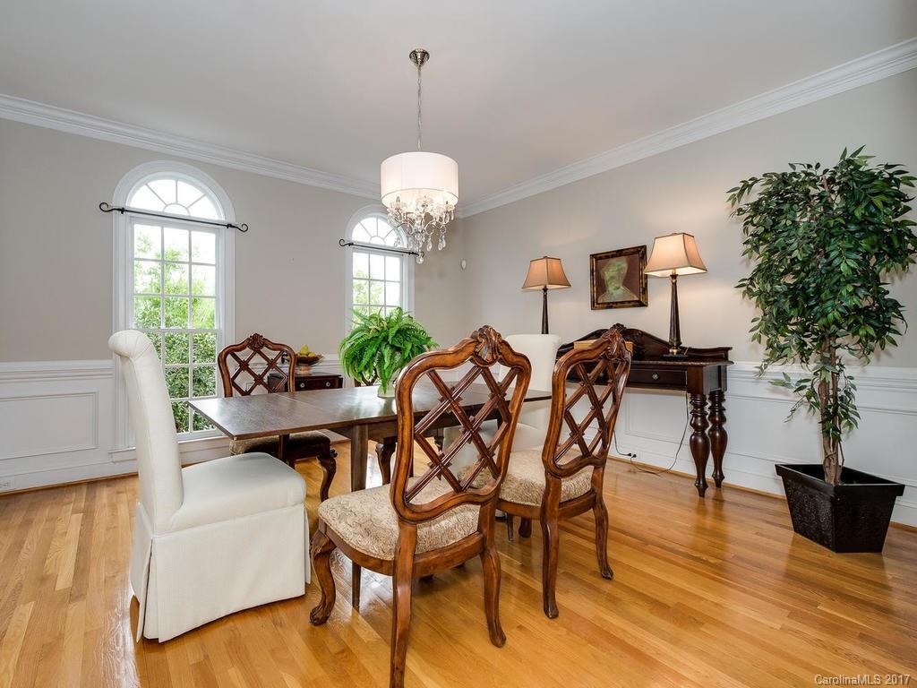 1415 Windy Ridge Road Charlotte, NC 28270 - Photo 4 of 24 a view of a dining room with furniture and wooden floor