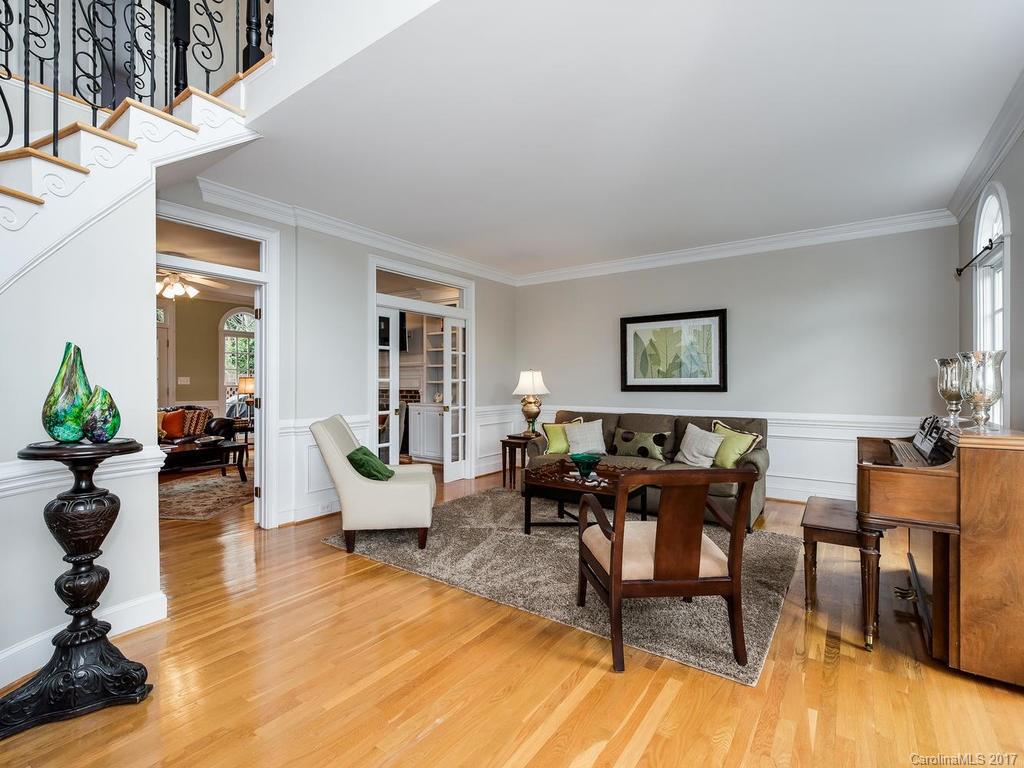 1415 Windy Ridge Road Charlotte, NC 28270 - Photo 5 of 24 a living room with furniture dining table and a potted plant