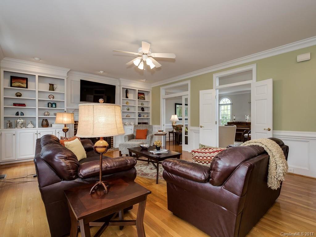 1415 Windy Ridge Road Charlotte, NC 28270 - Photo 8 of 24 a living room with furniture fireplace and a flat screen tv