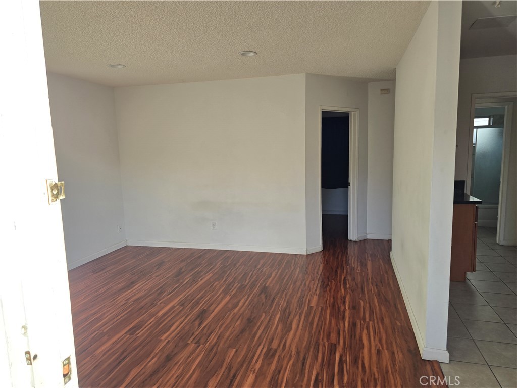 1012 Davis Avenue, Unit B Glendale, CA 91201 - Photo 2 of 11 an empty room with wooden floor and entrance