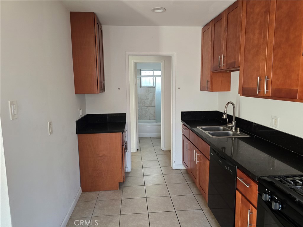 1012 Davis Avenue, Unit B Glendale, CA 91201 - Photo 4 of 11 a kitchen with stainless steel appliances granite countertop a sink stove and cabinets