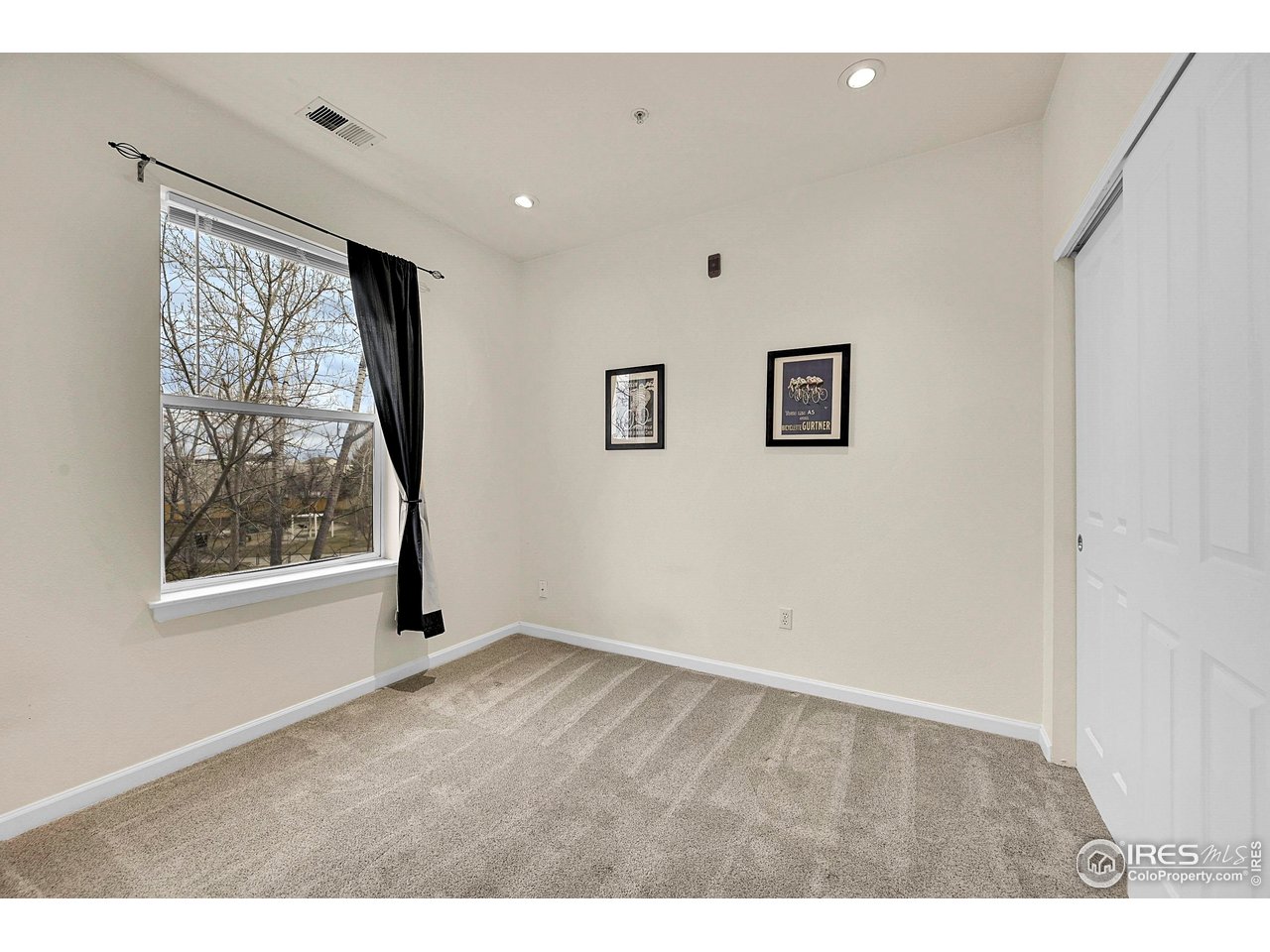 2645 Tabriz Place, Unit 22 Boulder, CO 80304 - Photo 15 of 29 a view of an empty room with a window