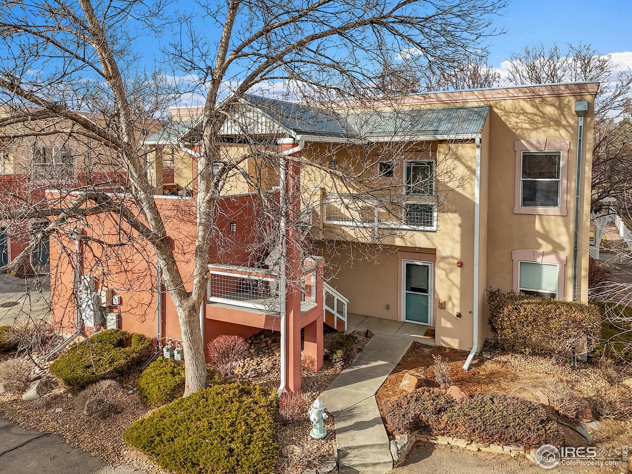 2645 Tabriz Place, Unit 22 Boulder, CO 80304 - Photo 27 of 29 a backyard of a house with large trees and barbeque oven
