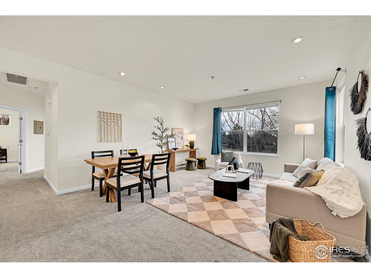 2645 Tabriz Place, Unit 22 Boulder, CO 80304 - Photo 3 of 29 a living room with furniture and a large window