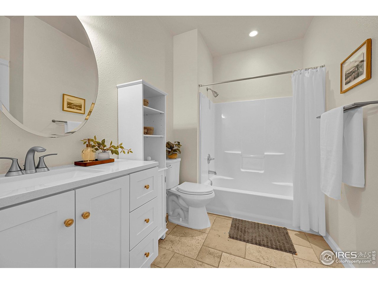 2645 Tabriz Place, Unit 22 Boulder, CO 80304 - Photo 9 of 29 a bathroom with a granite countertop sink a toilet a mirror a vanity and shower