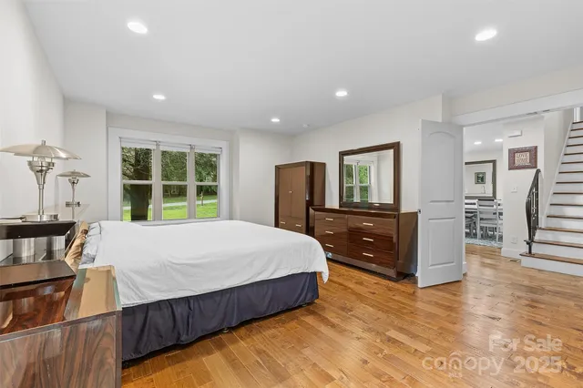 a bed room with a bed and a television