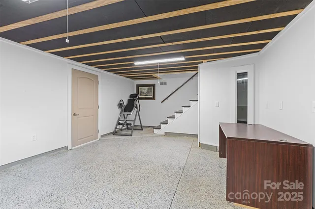 a view of a hallway with stairs