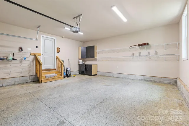 a view of a storage & utility room with two washing machine