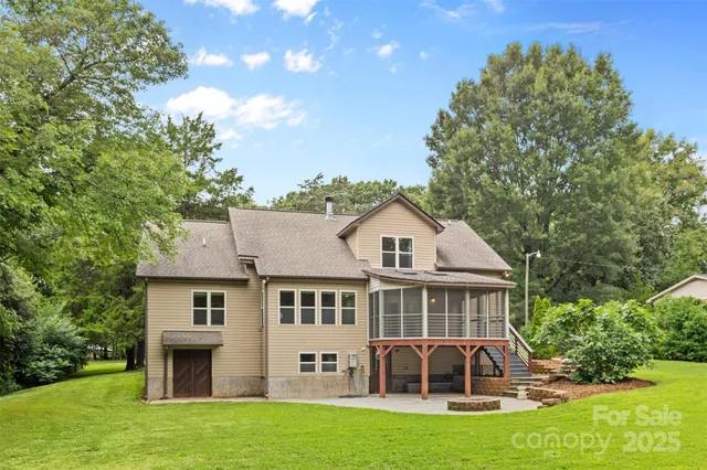 a front view of a house with a garden and porch
