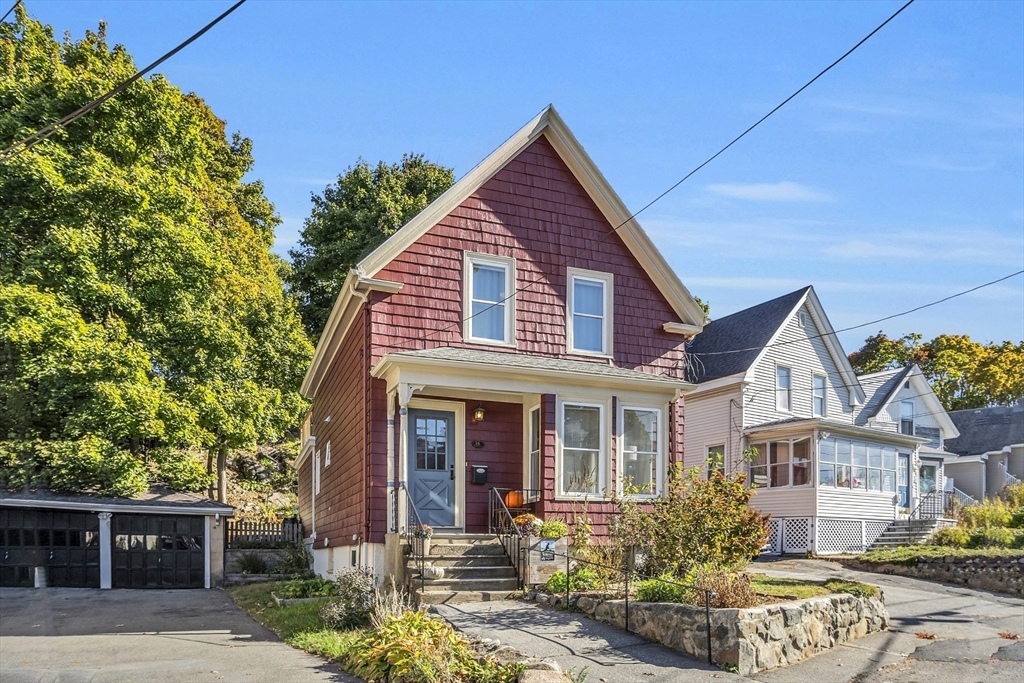 a front view of a house with garden