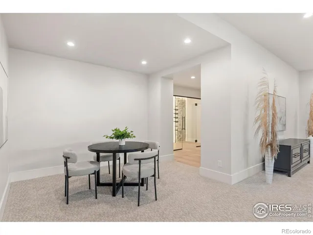 a view of a room with furniture and a window