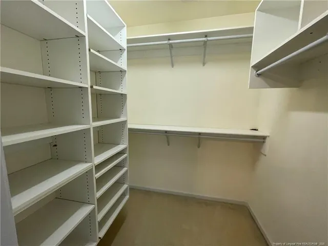a view of an empty walk in closet