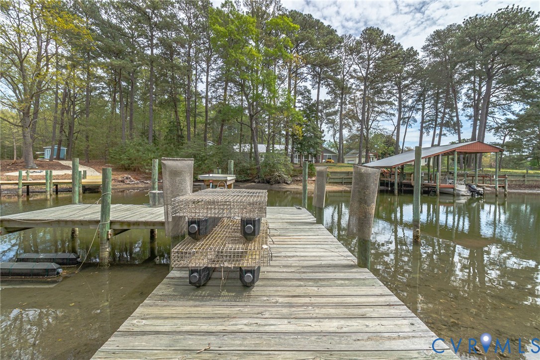 193 Deep Water Lane Reedville, VA 22539 - Photo 77 of 84 The property features a wooden dock extending over