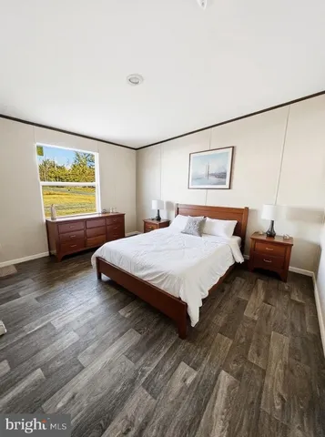 a spacious bedroom with a bed and window