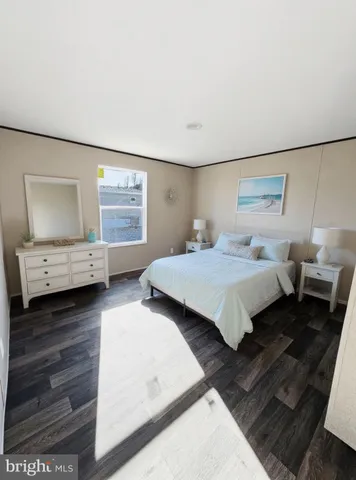 a bedroom with a bed and a view of bedroom