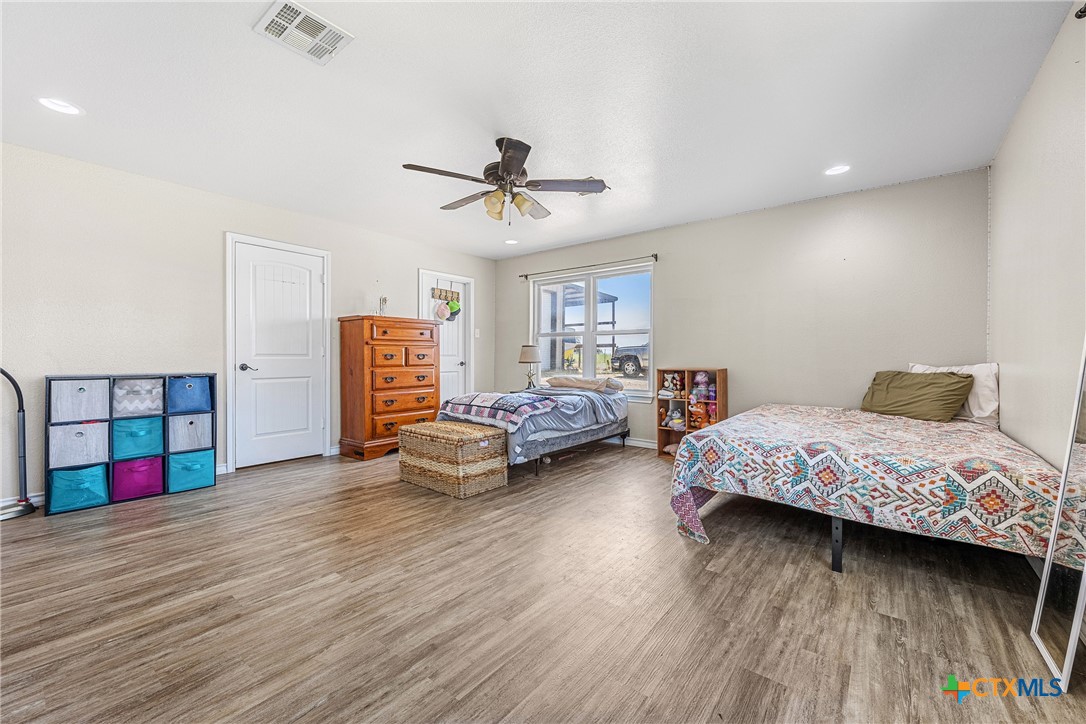16101 Dove Road Moody, TX 76557 - Photo 29 of 42 a bedroom with furniture and a wooden floor