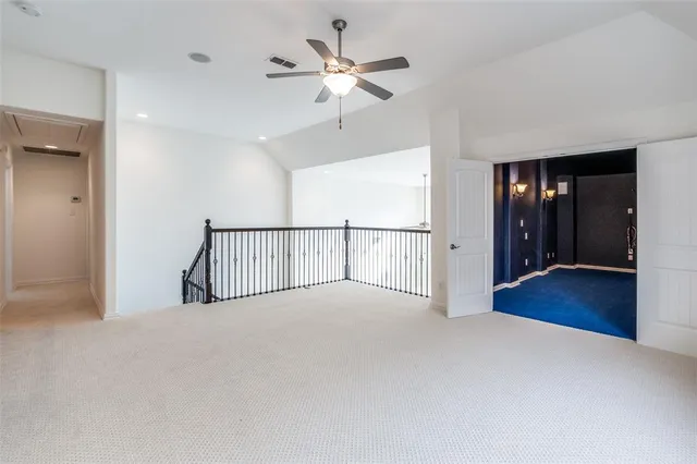 a view of a livingroom with a ceiling fan and a ceiling fan