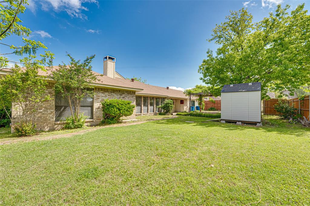 3410 Conlin Drive Rowlett, TX 75088 - Photo 22 of 27 a front view of house with yard and trees