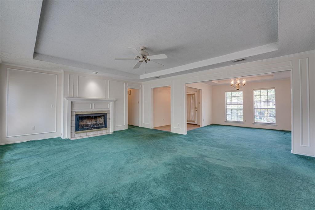 3410 Conlin Drive Rowlett, TX 75088 - Photo 4 of 27 a view of a livingroom with a fireplace and window
