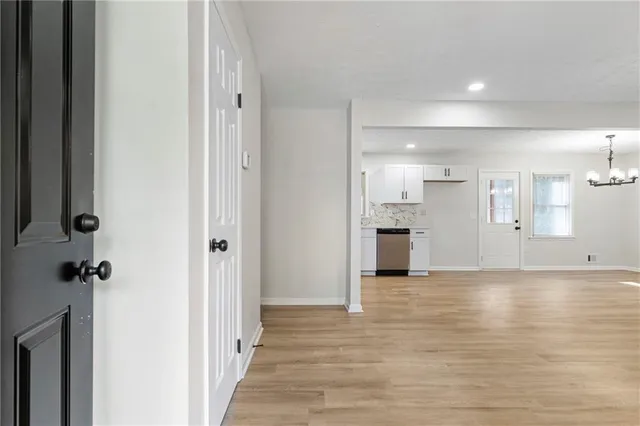 a view of a kitchen with a sink and a refrigerator