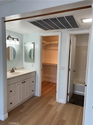 a bathroom with a double vanity sink and mirror