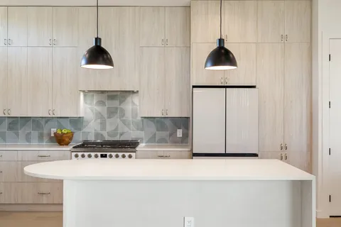 a kitchen with a cabinets and a stove