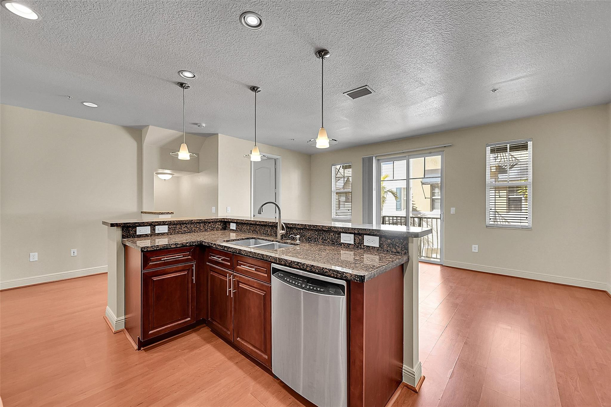 3605 Northwest 5th Terrace Boca Raton, FL 33431 - Photo 16 of 48 a kitchen with a sink and stove
