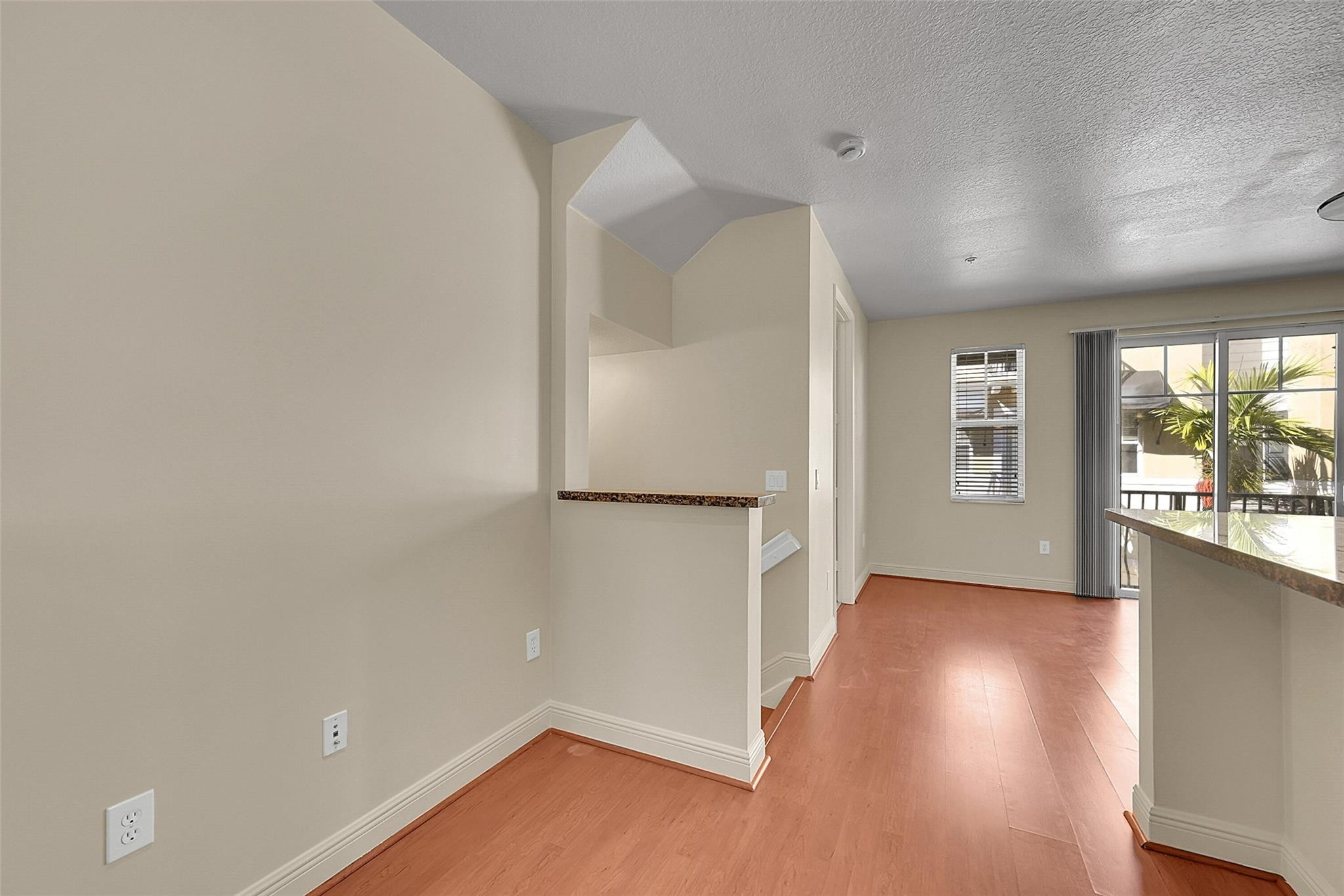 3605 Northwest 5th Terrace Boca Raton, FL 33431 - Photo 17 of 48 an empty room with wooden floor and windows