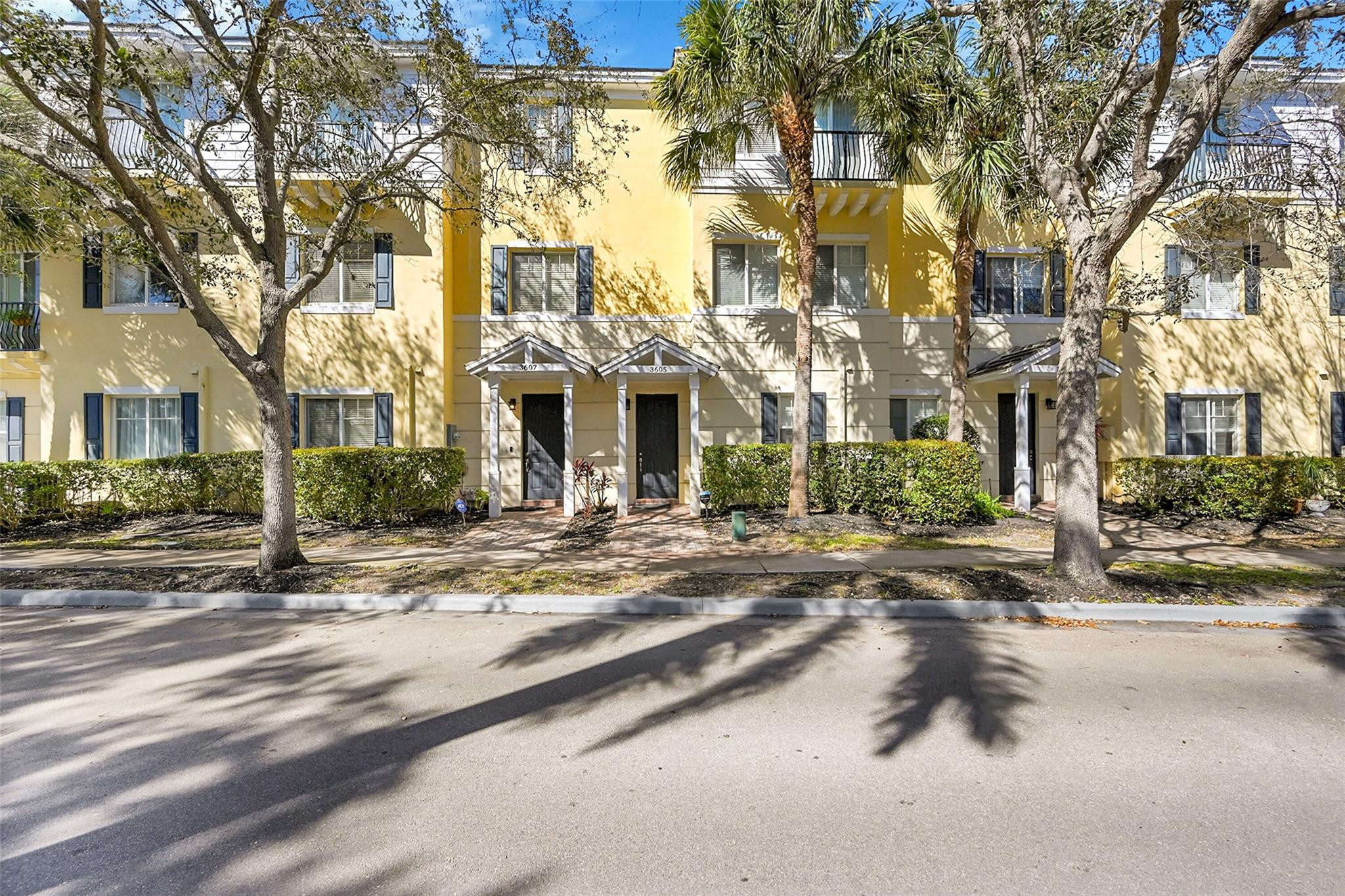 3605 Northwest 5th Terrace Boca Raton, FL 33431 - Photo 2 of 48 front view of a building with a street