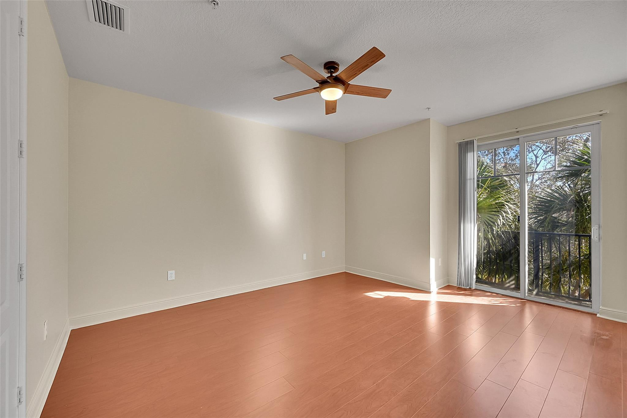 3605 Northwest 5th Terrace Boca Raton, FL 33431 - Photo 24 of 48 an empty room with windows and view of a wooden floor