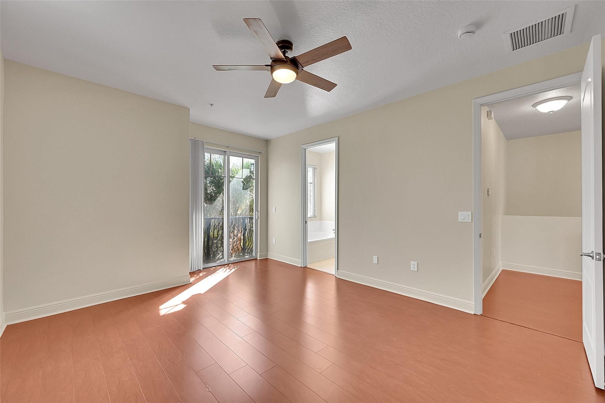 3605 Northwest 5th Terrace Boca Raton, FL 33431 - Photo 25 of 48 wooden floor in an empty room with a window