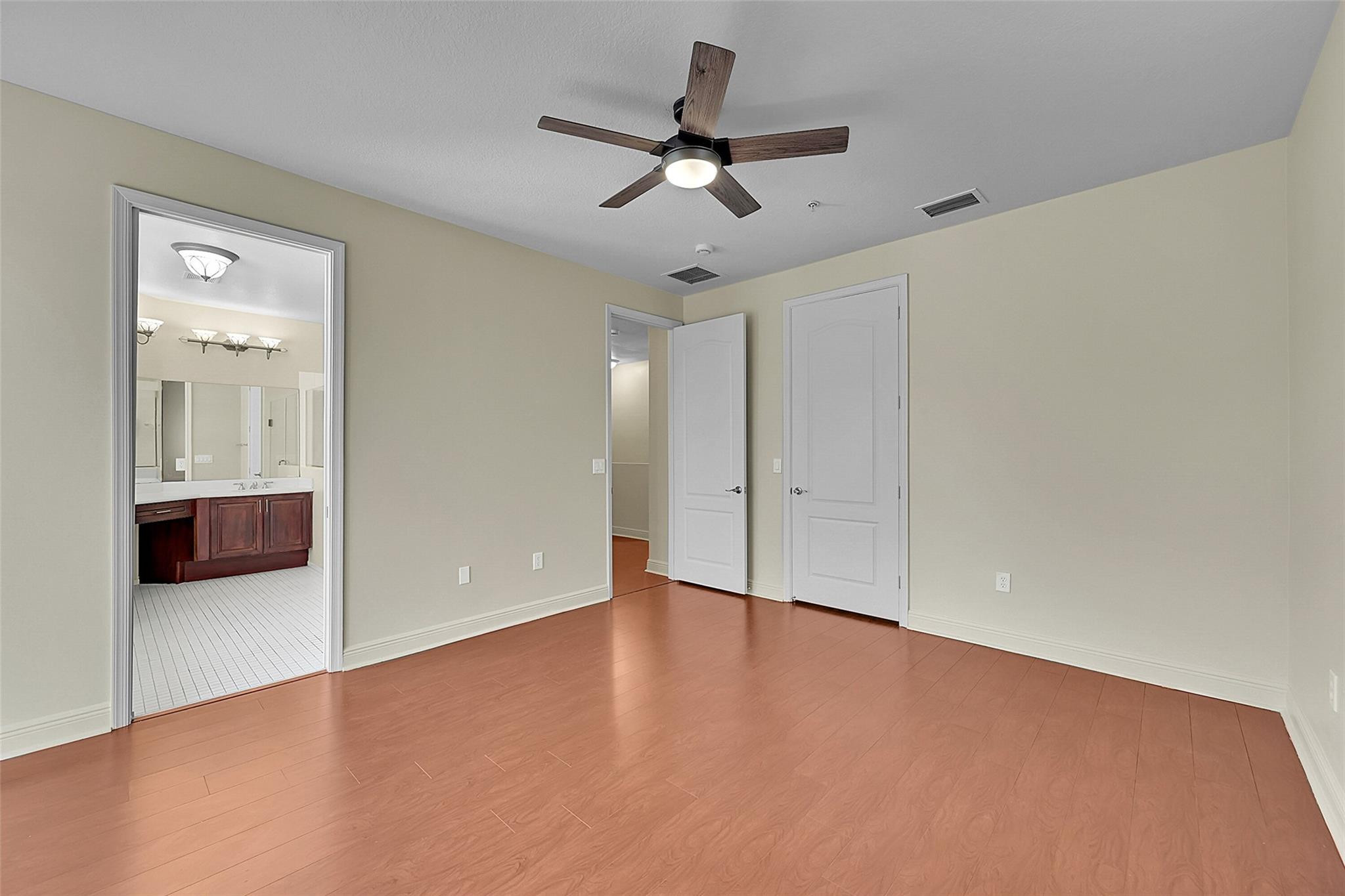 3605 Northwest 5th Terrace Boca Raton, FL 33431 - Photo 26 of 48 an empty room with closet and windows
