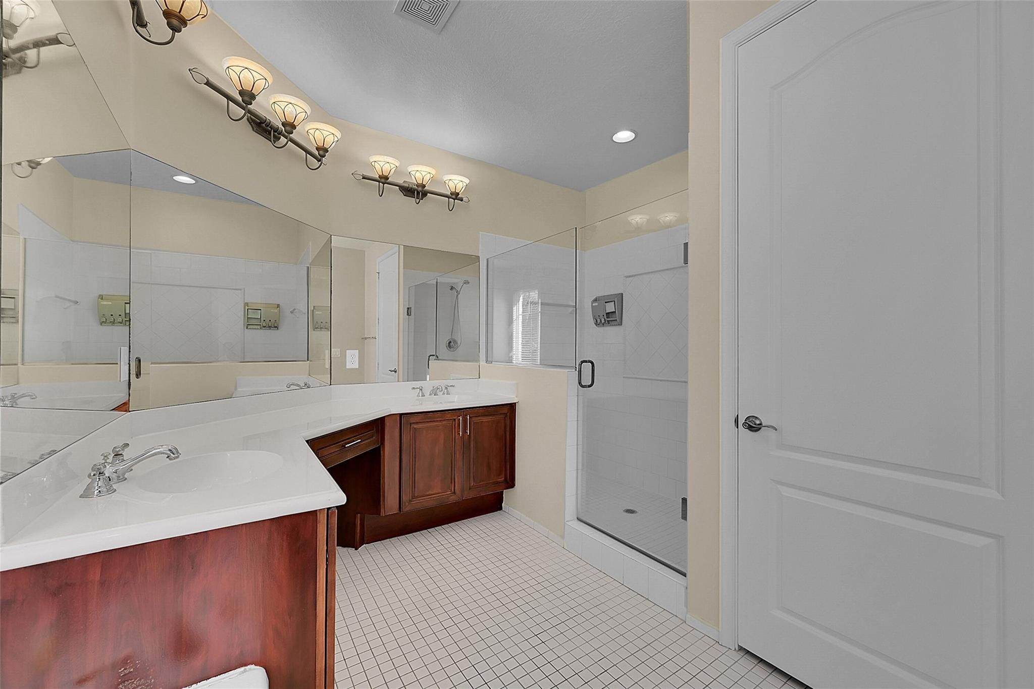 3605 Northwest 5th Terrace Boca Raton, FL 33431 - Photo 28 of 48 a bathroom with a sink a large mirror and shower