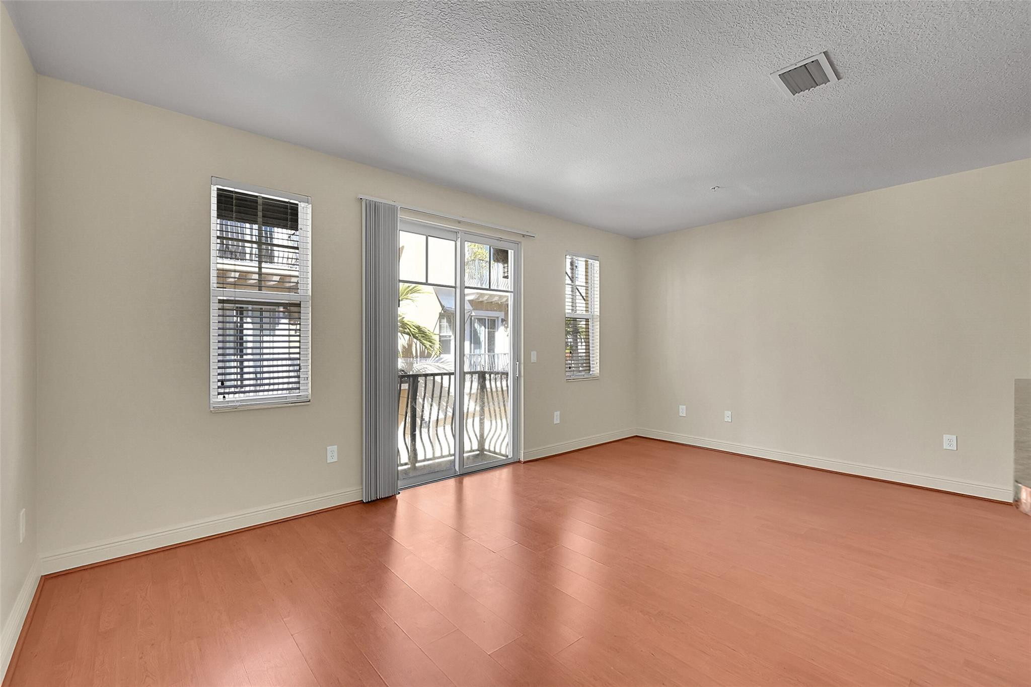 3605 Northwest 5th Terrace Boca Raton, FL 33431 - Photo 8 of 48 wooden floor in an empty room with a window